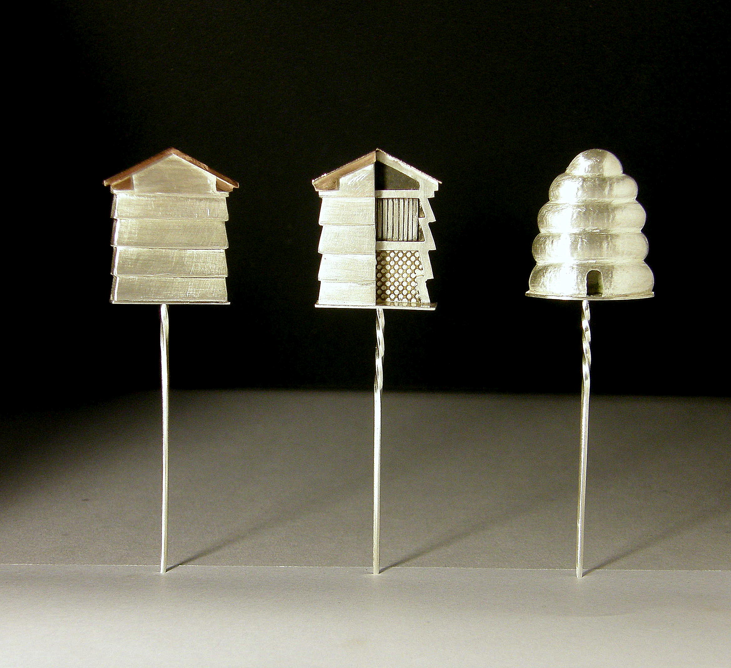 Three beehive stickpins, 2010, silver and red gold, 21x30x8mm deep