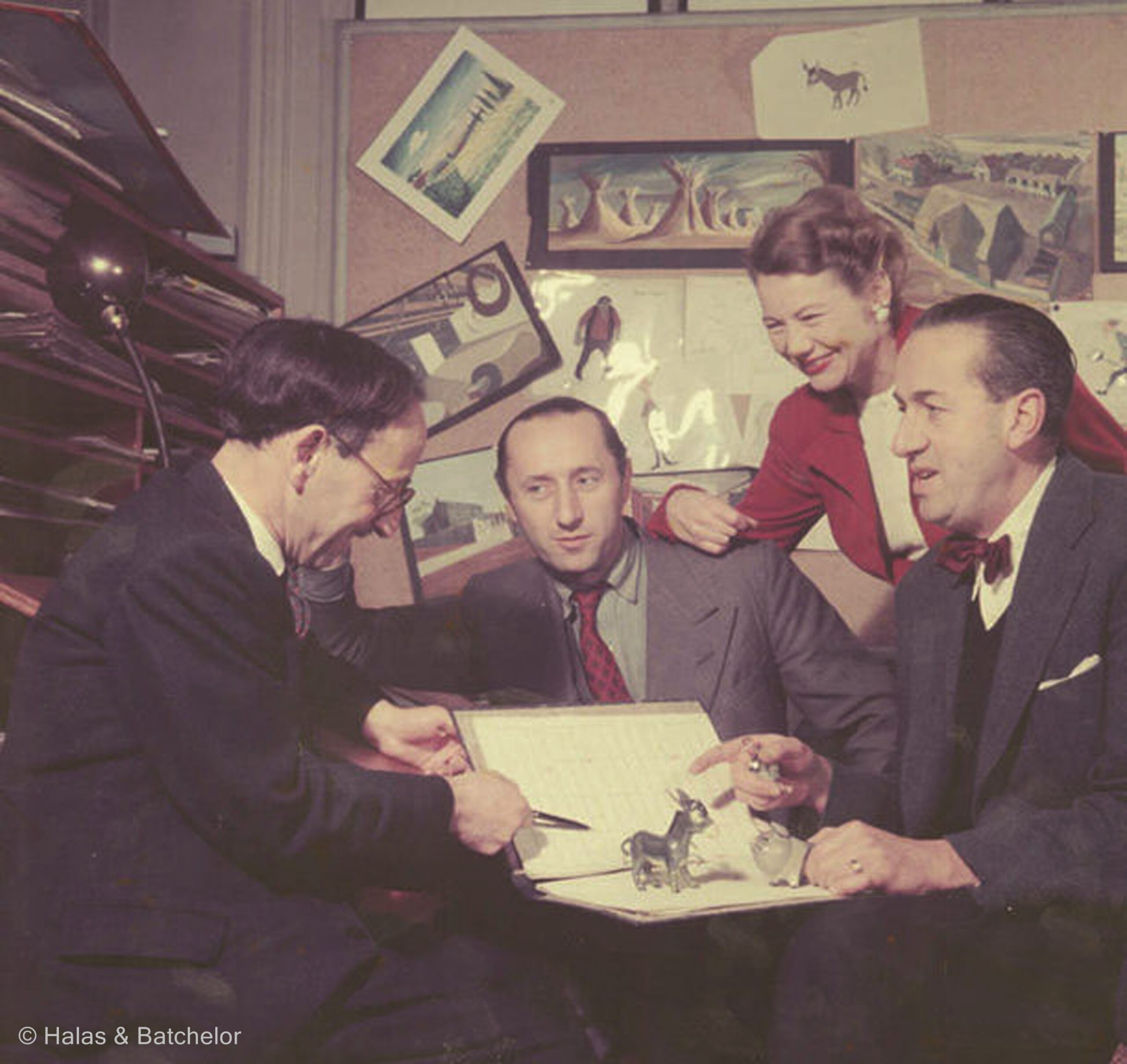 L-R Composer Mátyás Seiber with John Halas, Joy Batchelor and John Reed discuss the models for Animal Farm (1954)