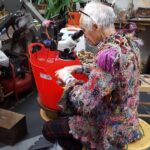 Malcolm Appleby wearing signature jumper, in his workshop, © Armadillo Central, 2017