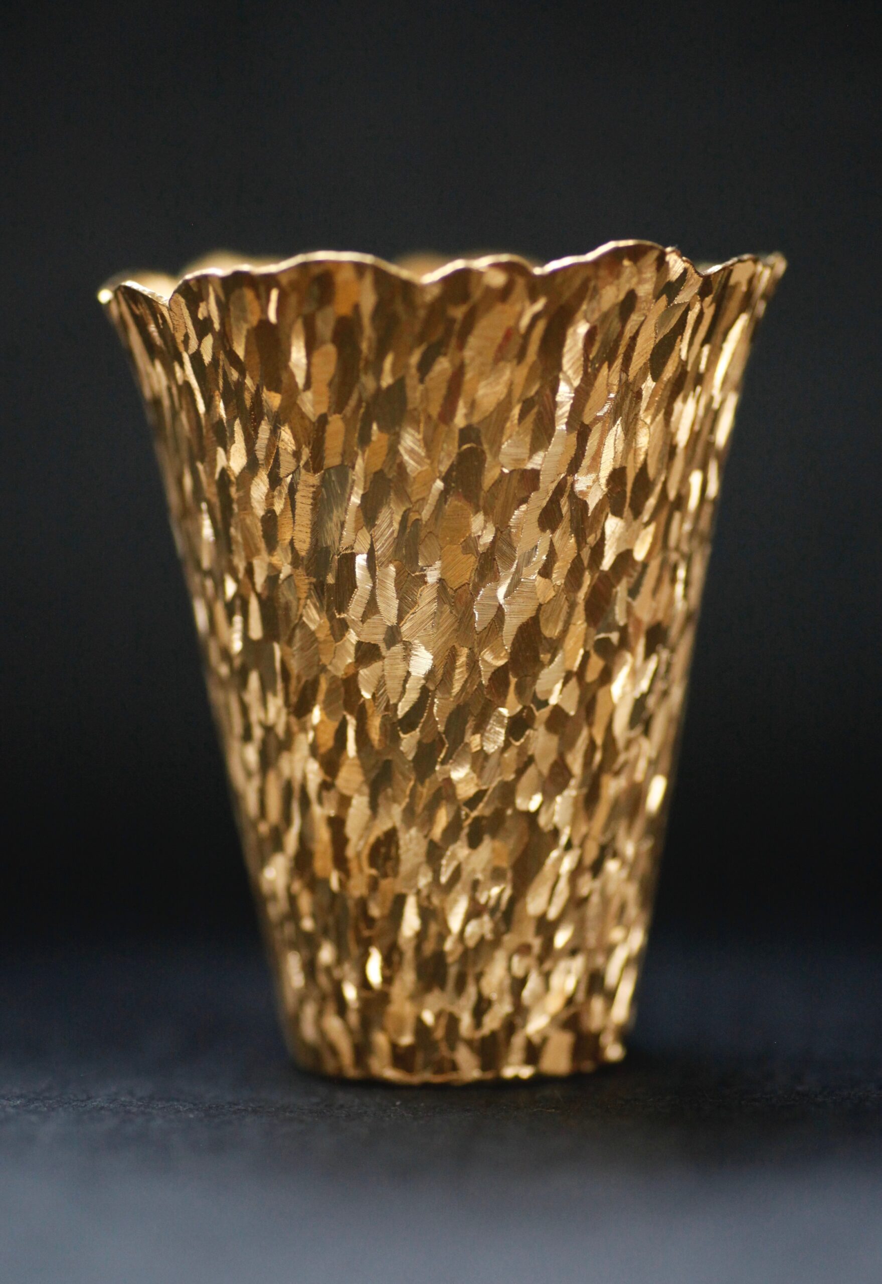 Harlequin Hammer, hammer raised and engraved beaker, 2018, 22ct gold, H 8 x dia 7.6 cm © Philippa Swann