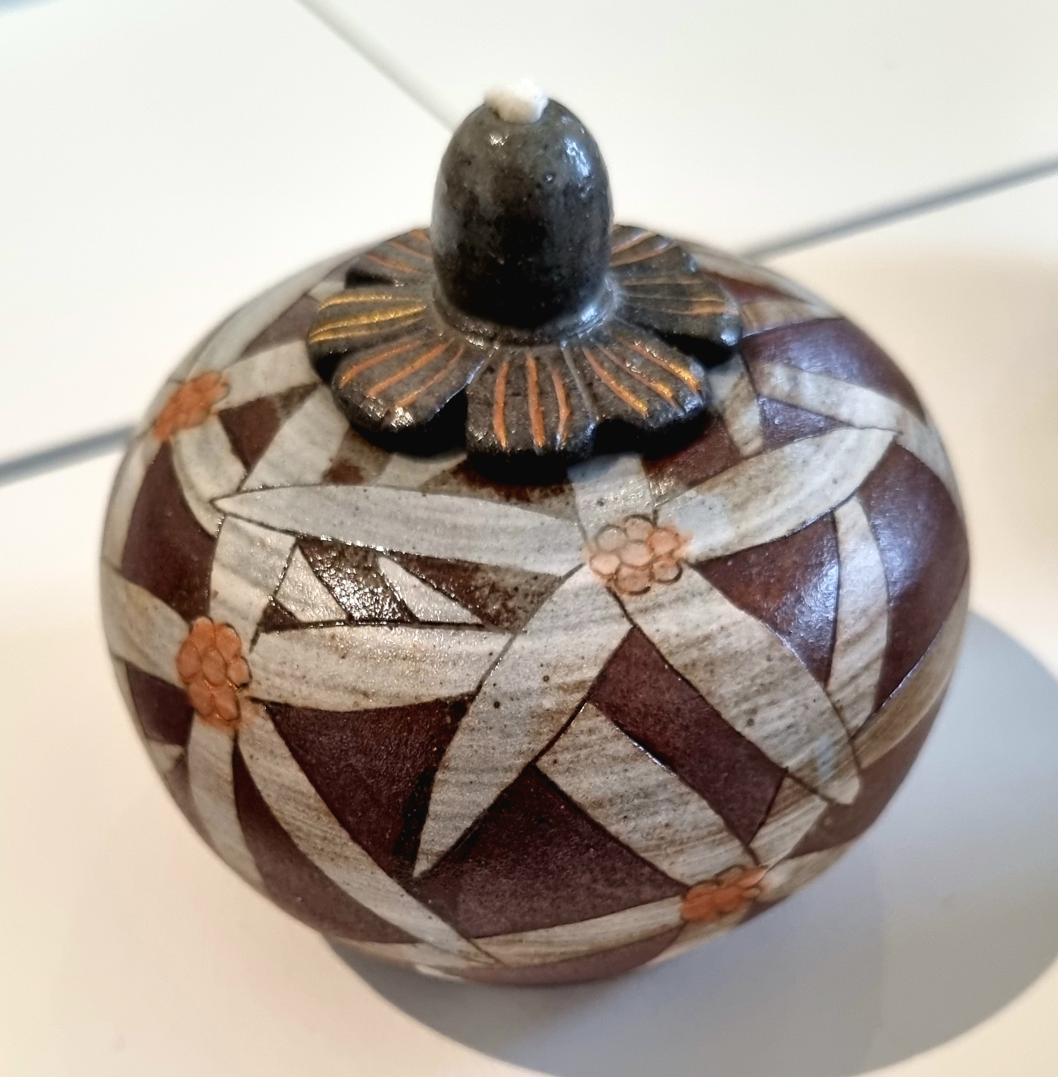 Na Yong-hwan, Lidded Vessel, 2024, stoneware, white slip. The artist has been focussing on Buncheong ceramics for over 30 years, using traditional techniques, primarily buncheong inlays and stamping. These practices are based on the Korean sentiment and aesthetics of ‘restoring the old and creating the new’ represented by Han Collection