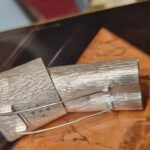 Francisca Onumah's sculptural brooch showing pin and hallmarks at the back